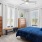 bedroom with bed dresser and large windows