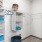 closet with hangers and bags on shelf