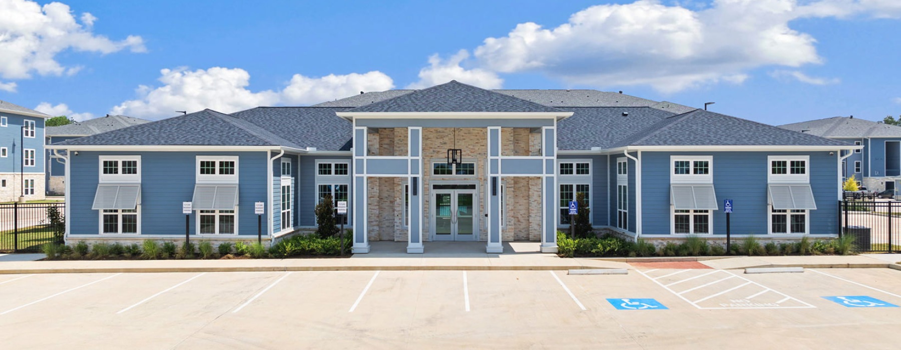 clubhouse with parking lot