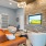 lounge area with seating and a tv