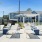 outdoor patio with table seating and fence
