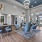spacious lounge area with high ceilings, bright lighting and ample seating